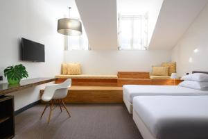 Cama o camas de una habitación en Inspira Liberdade Boutique Hotel