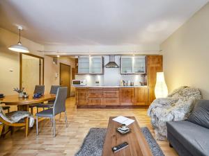 a living room with a couch and a table at VisitZakopane - Nosal Apartment in Zakopane