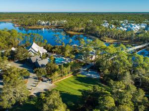 an aerial view of the house and the lake at Watercolor Whimsea in Seagrove Beach