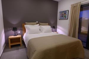 Uma cama ou camas num quarto em Laje da Bica Agroturismo