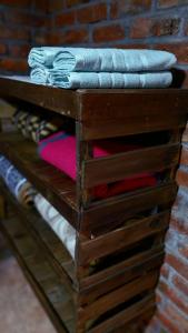a wooden dresser with clothes on top of it at Elst House in Mendoza