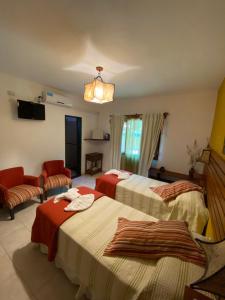Postel nebo postele na pokoji v ubytování Hotel Complejo Najul Suites-Solo Adultos