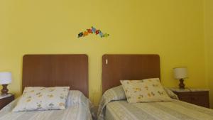 A bed or beds in a room at Majella National Park La Casa Di Nonna Maria Még 14 kép