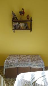 A bed or beds in a room at Majella National Park La Casa Di Nonna Maria