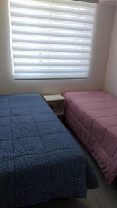 Ein Bett oder Betten in einem Zimmer der Unterkunft Vista Pacifico, Serena