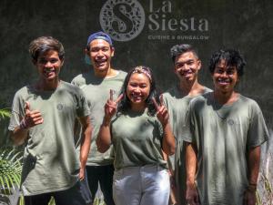 a group of people posing for a picture at La Siesta bungalows & Cuisine in Gili Islands