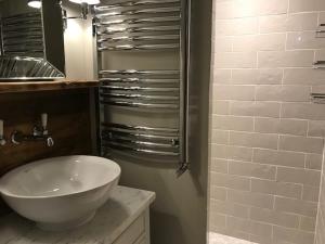 a bathroom with a white sink and a shower at 3 pièces au pied des pistes avec balcon et WIFI à Tignes - FR-1-449-50 in Tignes +8 photos
