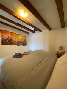 A bed or beds in a room at Best view of Meteora in ''Stavros home''