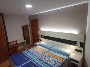 Postel nebo postele na pokoji v ubytování Hostal Restaurante El Castillo