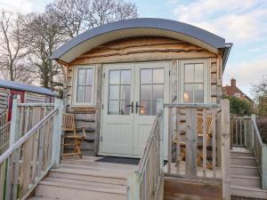 a tiny house with a gazebo on a deck at Folklore in York