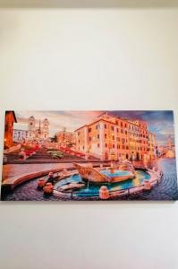 a painting of boats in a canal with buildings at Casa Mirandola in Rome