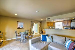 a living room with a couch and a table at Carefree Casita with Outdoor Pool and Mountain View! in Carefree