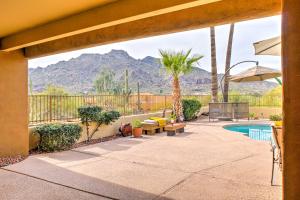 a patio with a pool and mountains in the background at Carefree Casita with Outdoor Pool and Mountain View! in Carefree