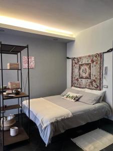 a bedroom with a bed with a pillow on it at Casa Roberto in Cefalù