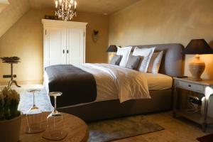 Postel nebo postele na pokoji v ubytování Boutique Hotel De Brakelhoen