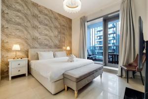 Postel nebo postele na pokoji v ubytování Vacationer I Sparkle 1 Bedroom I Marina Views I Steps away from Beach I Gym, Pool, Parking & Wi-Fi