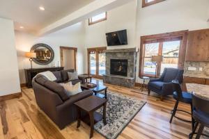 a living room with a couch and a fireplace at Modern Mountain Lodge Oasis w Hot Tub-Rio Grande Trail in Carbondale