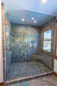 a bathroom with a shower with a glass door at Modern Mountain Lodge Oasis w Hot Tub-Rio Grande Trail in Carbondale