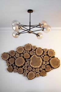 a chandelier with coins in the shape of a heart at Brick House Premium Apartments in Wrocław