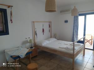 Postel nebo postele na pokoji v ubytování Venetiko Studios