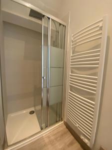 a shower with a glass door in a bathroom at T2 Duplex Châtelaillon-Plage in Châtelaillon-Plage