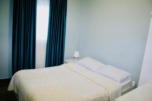 Postel nebo postele na pokoji v ubytování REM House