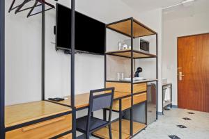 a room with a desk and a chair in a room at Suites Reforma by HomiRent in Mérida
