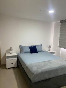 Postel nebo postele na pokoji v ubytování Hermoso, moderno y confortable apartamento. + 12 fotografií