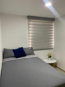 Postel nebo postele na pokoji v ubytování Hermoso, moderno y confortable apartamento.