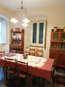 a dining room with a table and some chairs at La Dimora del tempo ritrovato in Roccamandolfi