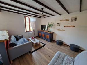 a living room with a couch and a table at Escapade sur le port de Dinan in Dinan