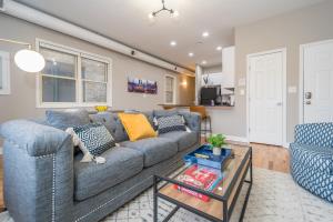 a living room with a couch and a table at Vibrant and Modern 2-Bedroom Home Near Downtown in Chicago