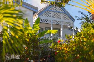 a white house with a white pergola at La Vista Resort in Simpson Bay