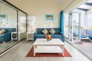 a living room with a couch and a table at La Vista Resort in Simpson Bay