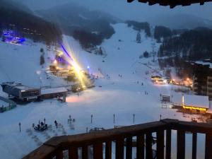 a view of a ski slope at night at Carlines'home in Les Orres