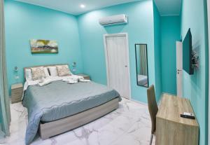 Rúm í herbergi á B&B Dint 'o core e Napule
