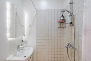 a bathroom with a sink and a shower at AirHome - Owl's Nest 2 in Tallinn +15 photos