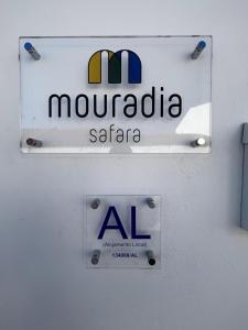 a sign on a wall with aaniaania sazona at Mouradia Safara in Safara