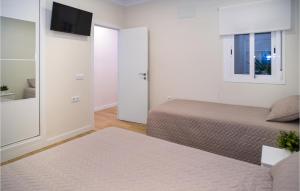 Ένα ή περισσότερα κρεβάτια σε δωμάτιο στο Nice Apartment In Conil De La Frontera