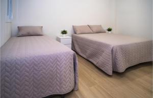 Ένα ή περισσότερα κρεβάτια σε δωμάτιο στο Nice Apartment In Conil De La Frontera +12 φωτογραφίες