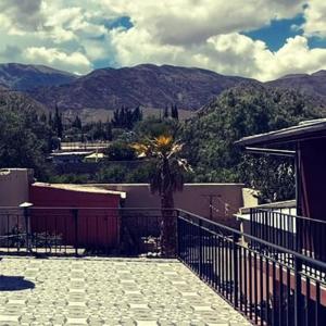 a balcony of a house with a view of a mountain at La Colorada Hostal in Tilcara