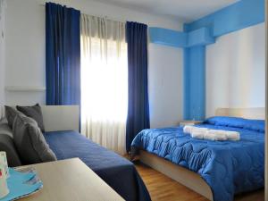 Tempat tidur dalam kamar di La Feluca Rooms & Breakfast