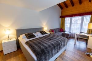 Postel nebo postele na pokoji v ubytování Chalet-Hotel Beau-Site