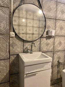 a bathroom with a sink and a mirror at Pousada do Pescador Eli in Fernando de Noronha