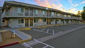 a parking lot in front of a building with a fire hydrant at Motel 6 Victorville in Victorville