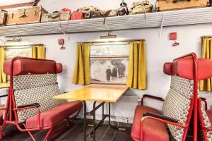 a dining room with chairs and a table in a train at Sure Hotel by Best Western Ole Tobias in Mo i Rana