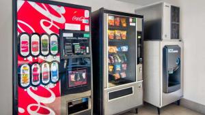 a coca cola vending machine next to a soda machine at Studio 6 Victorville - Apple Valley in Victorville