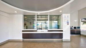 a lobby with a counter in a building at Studio 6 Victorville - Apple Valley in Victorville