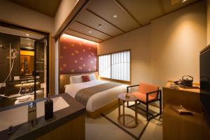 Uma cama ou camas num quarto em Onomichi Hansei