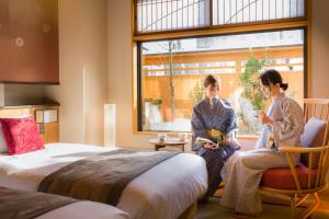 Uma cama ou camas num quarto em Onomichi Hansei